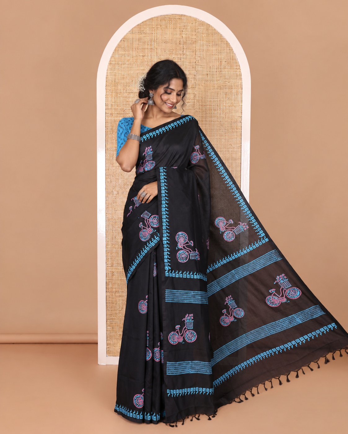 Black cycle with flower basket motifs block printed South cotton saree, Greek key motifs block printed border, a matching blouse, and a contrast floral motifs printed blouse