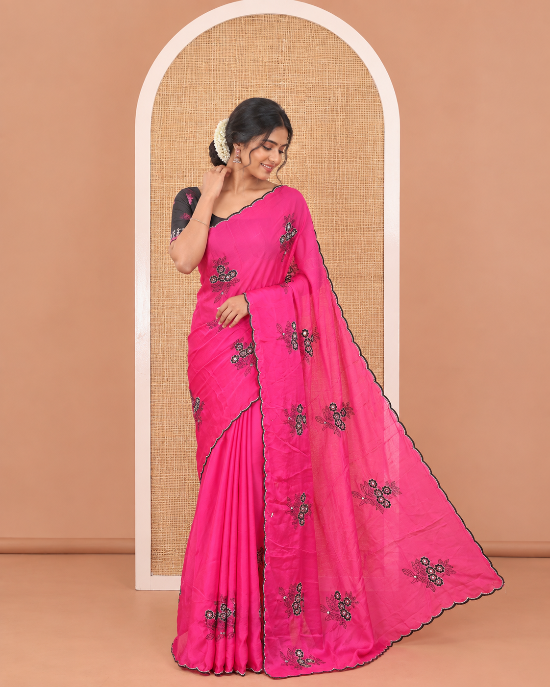 Rani Pink Rangoli Chiffon Saree, Decorated with Flower-Style Motifs Embroidered on Its Body, a Subtle Scallop Embroidered Border, a Self-Pallu, and Paired with a Contrast Embroidered Blouse