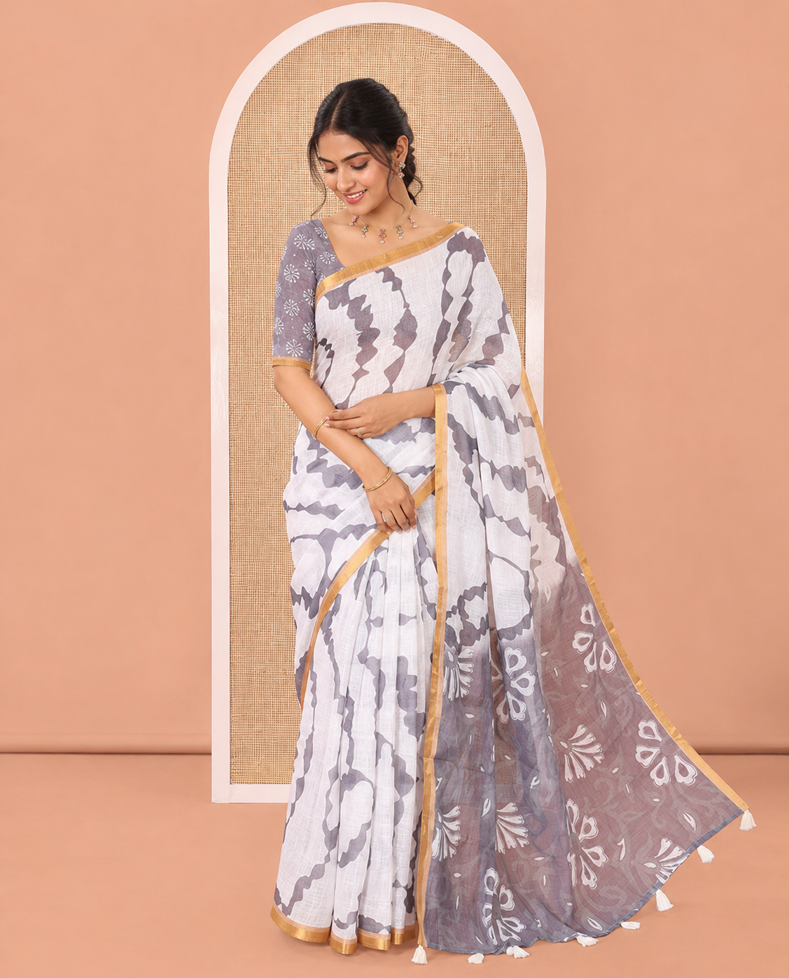 White-Grey Linen Cotton Saree, Accentuated with Shibori-Printed Body, Highlighted by Piping Border, Floral Printed Pallu, and Contrast Blouse