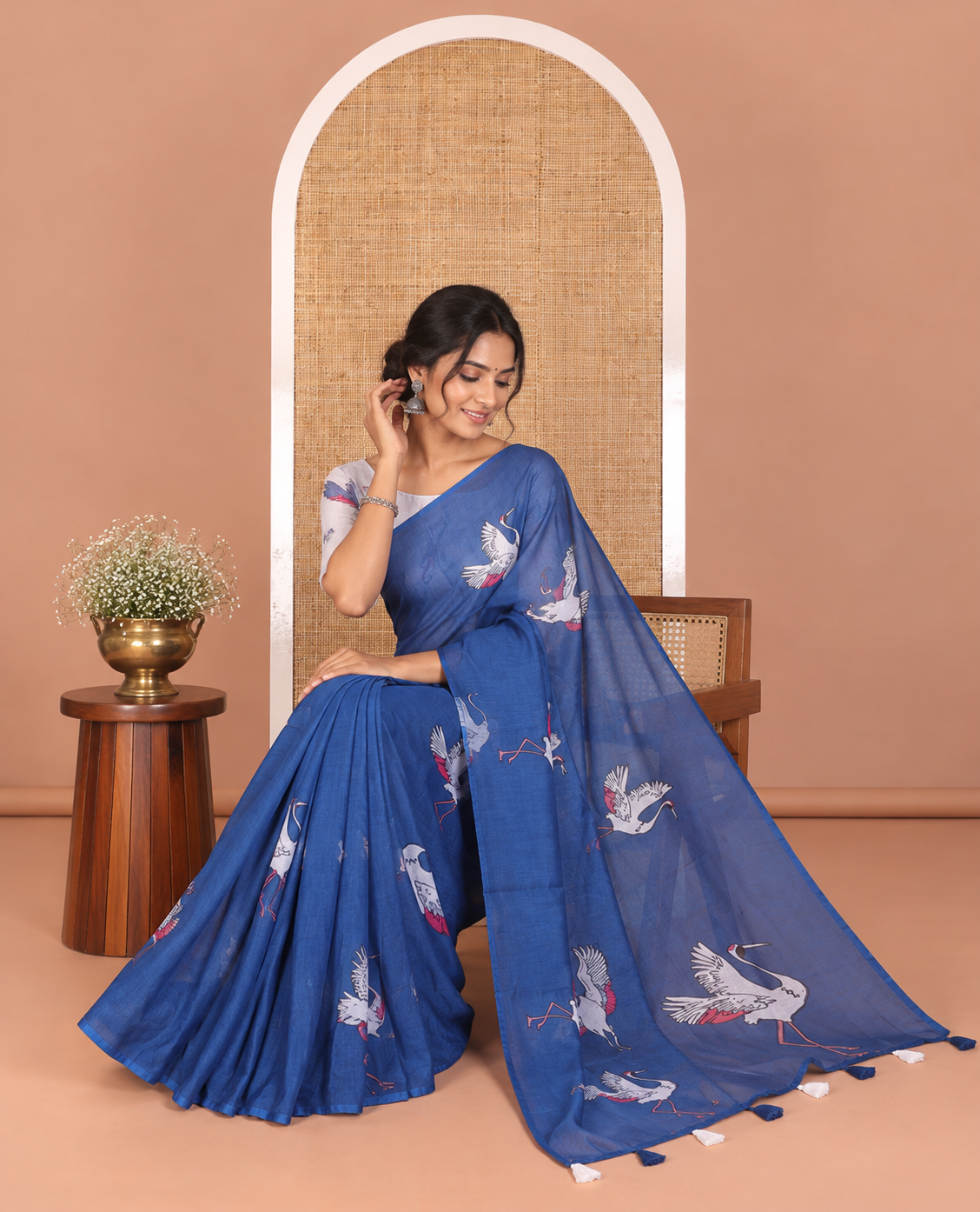 Borderless blue crane motifs printed linen cotton saree, crane motifs printed pallu, and a contrast crane printed blouse