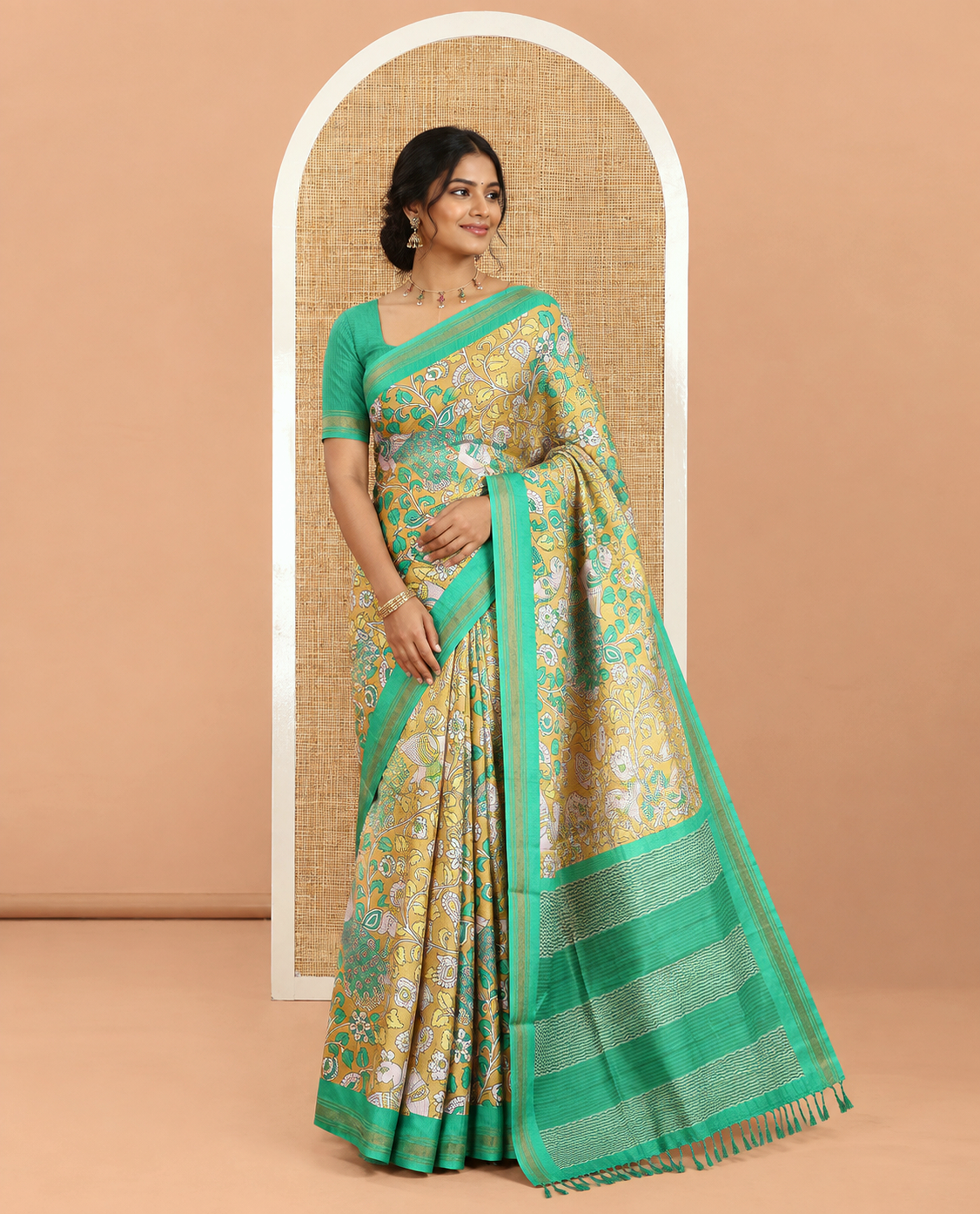 Mehenti Green Manipuri Silk Saree, Accentuated with Kalamkari-Style Floral Vine and Peacock Motifs Printed All Over Its Body, Complemented by a Contrast Zari Border, Pallu of Chevron Stripes, and Paired with a Contrast Blouse