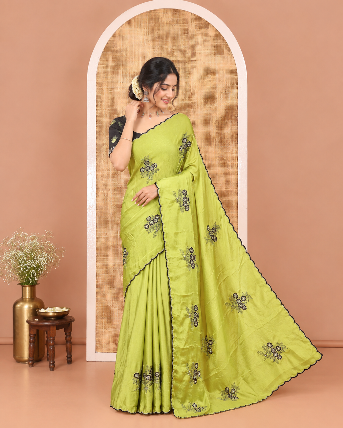 Green Rangoli Chiffon Saree, Elevated with Flower-Style Motifs Embroidered on Its Body, a Subtle Scallop Embroidered Border, a Self-Pallu, and Paired with a Contrast Embroidered Blouse