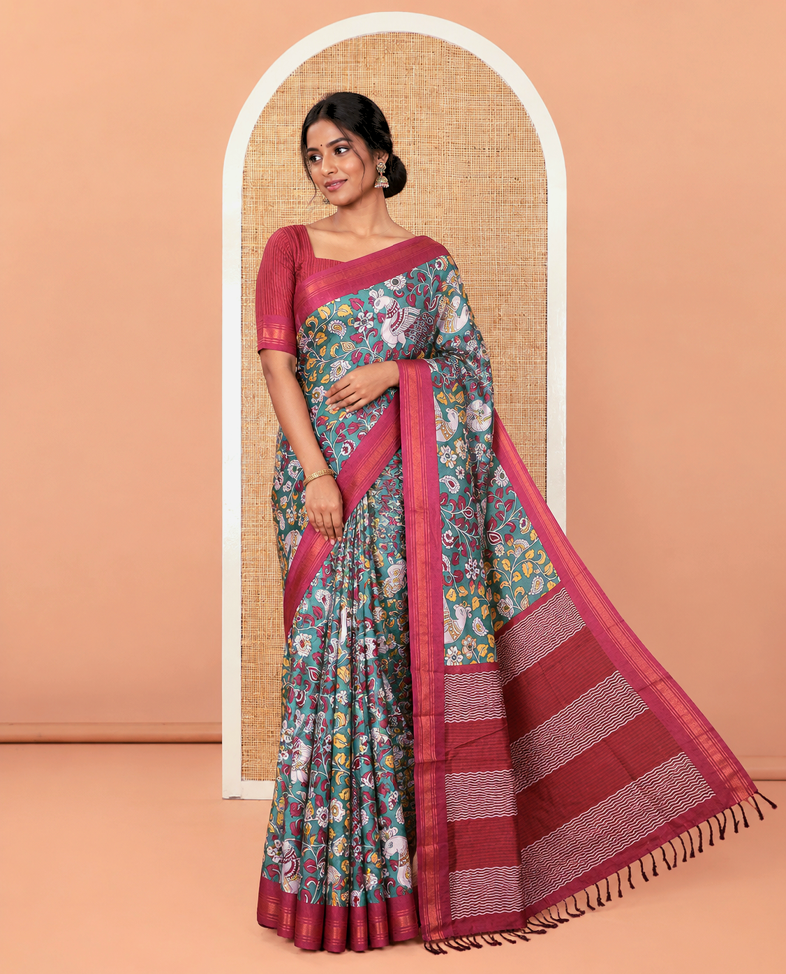 Dark Green Manipuri Silk Saree, Accentuated with Kalamkari-Style Floral Vine and Peacock Motifs Printed All Over Its Body, Complemented by a Contrast Zari Border, Pallu of Chevron Stripes, and Paired with a Contrast Blouse