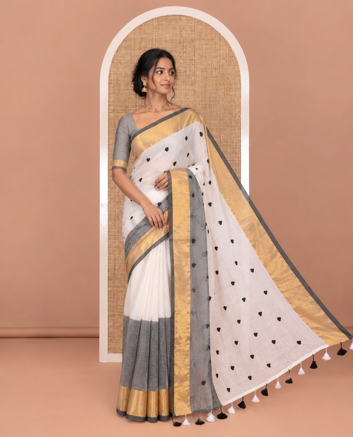 Grey heart motifs, red thread-embroidered half-and-half khadi mul cotton saree, zari border, self-pallu, and a plain blouse