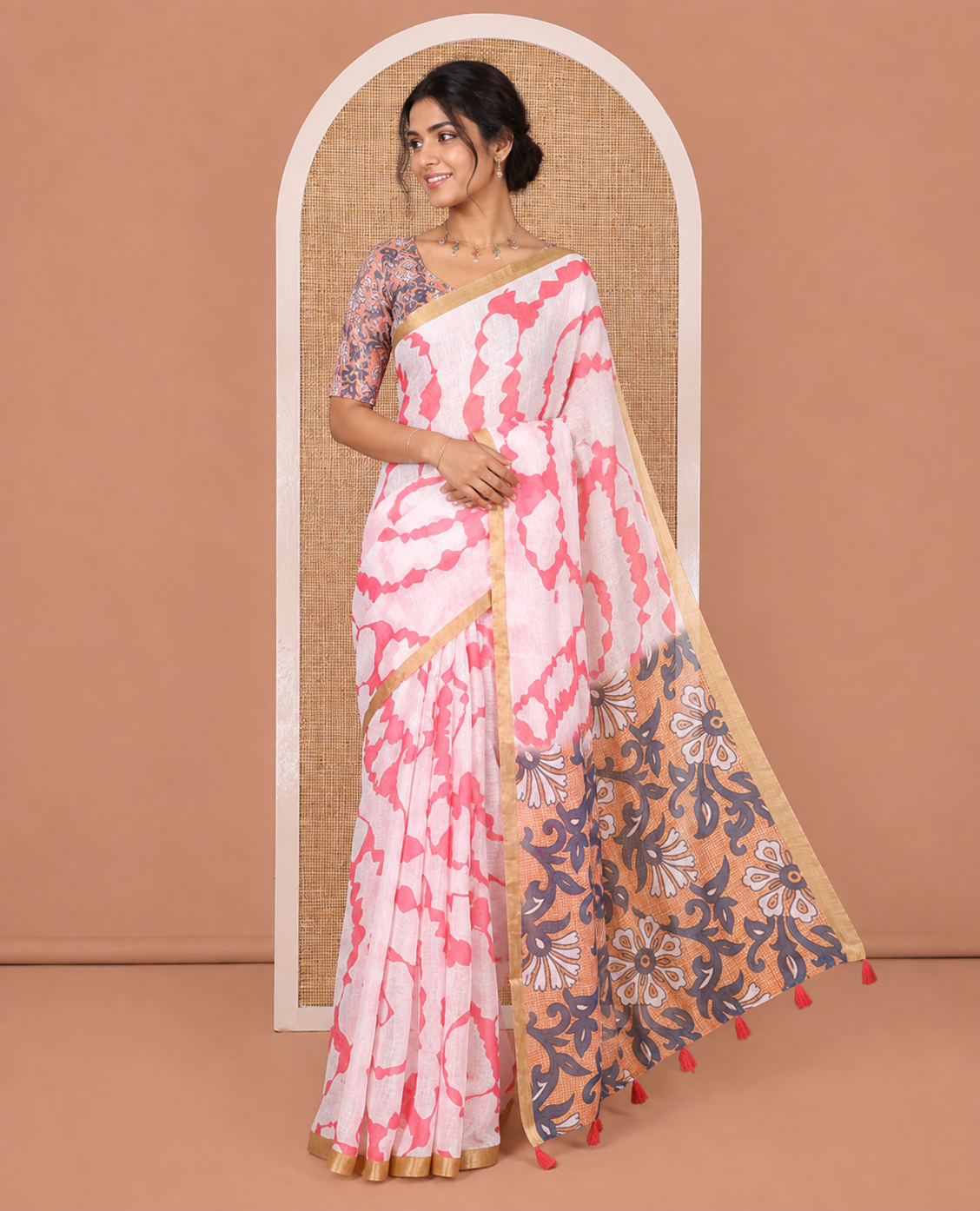 White-Pink Linen Cotton Saree, Bedecked with Shibori-Printed Body, Highlighted by Piping Border, Floral Printed Pallu, and a Contrast Blouse