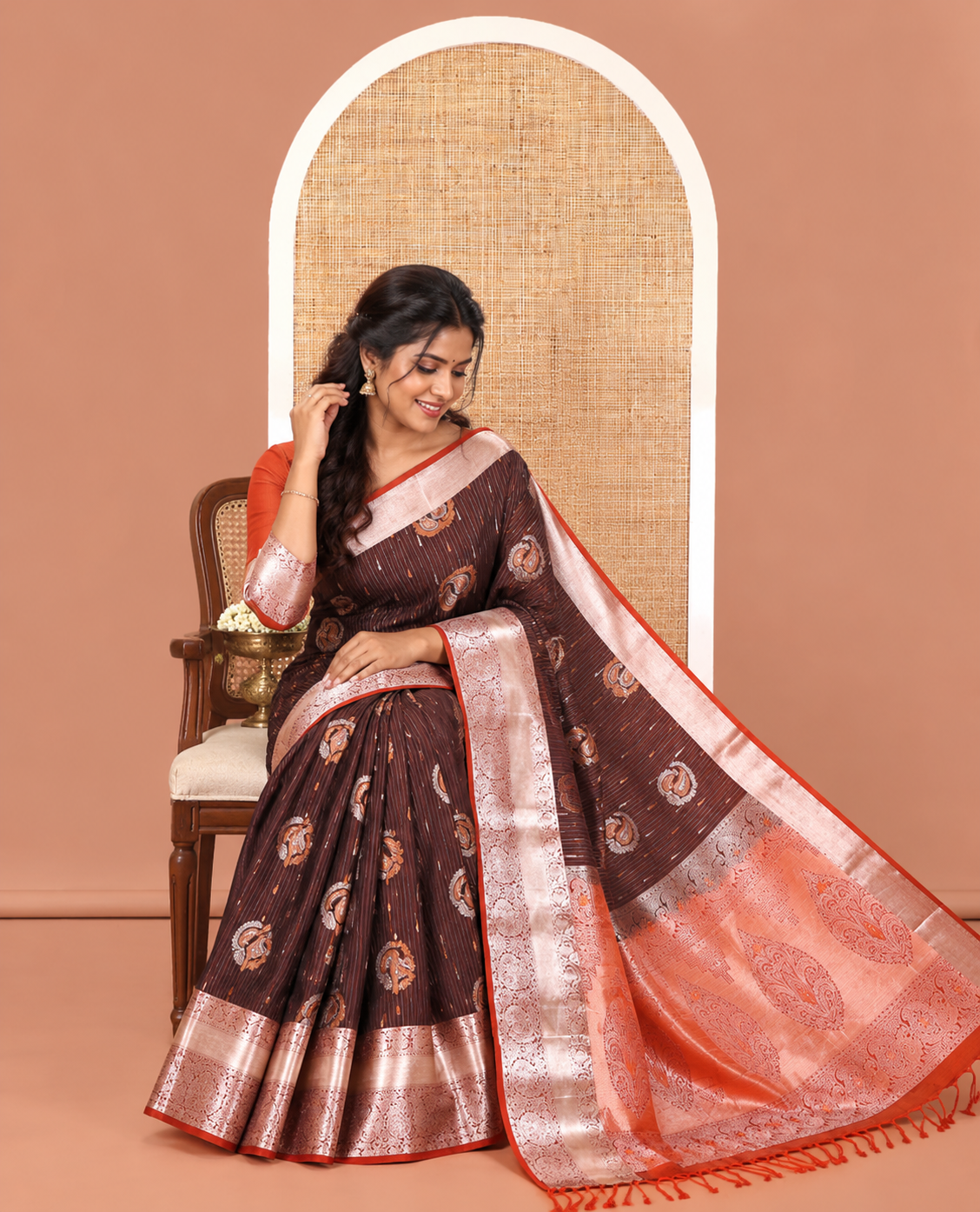 Coffee Brown Semi-Soft Silk Saree, Meticulously Crafted with Vaira Oosi, and Paisley Buttas All Over Its Body, Complemented by Contrast Traditional Border of Paisleys, Intricately Designed Pallu, and Paired with a Contrast Blouse