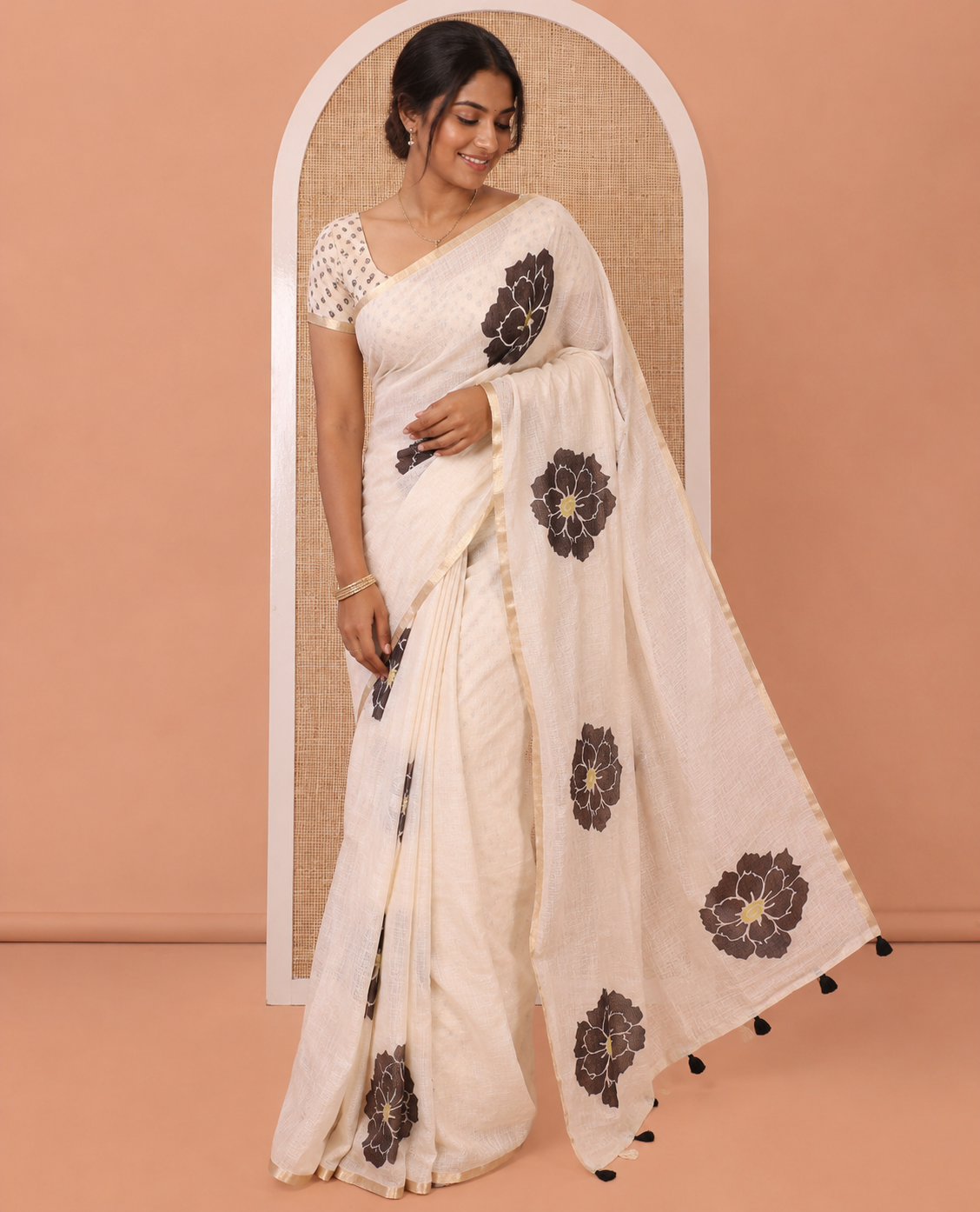Peach Linen Cotton Saree, Beautified with Flower Motifs Printed on Its Body, Subtle Piping Border, Self-Printed Pallu, and Paired with a Matching Blouse