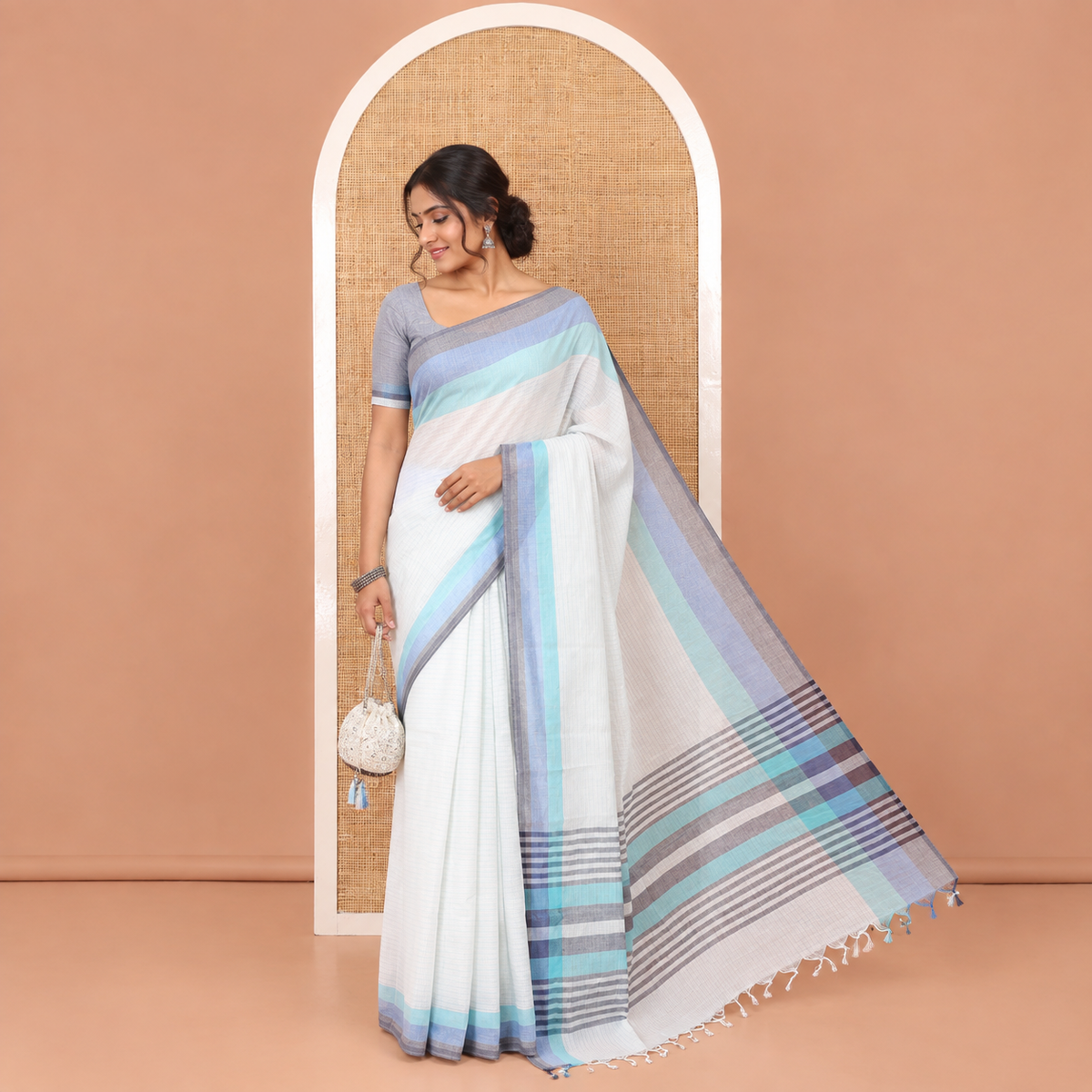 White and Blue Chettinad Cotton Saree, Subtly Sparkled with Stripes All Over Its Body, Complemented by a Contrast Tri-Colored Striped Border, Pallu of Stripes, and Has No Blouse