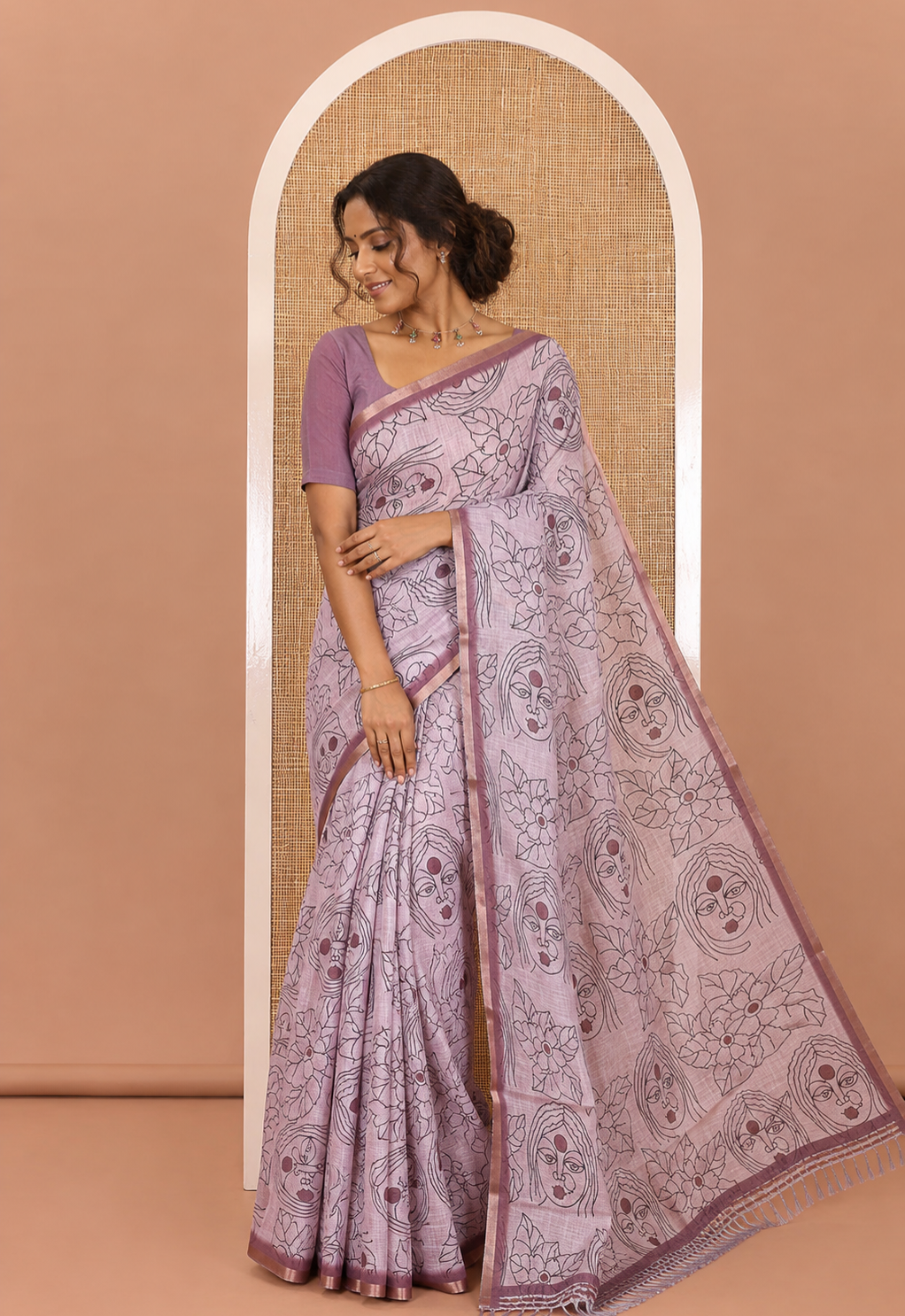 Light Mauve Linen Saree Creatively Printed with Girl Face and Floral Motifs All Over Its Body, Subtly Sparkled with Piping Zari Border, Pallu Mirrors the Same Body Print, and Paired with a Contrast Blouse