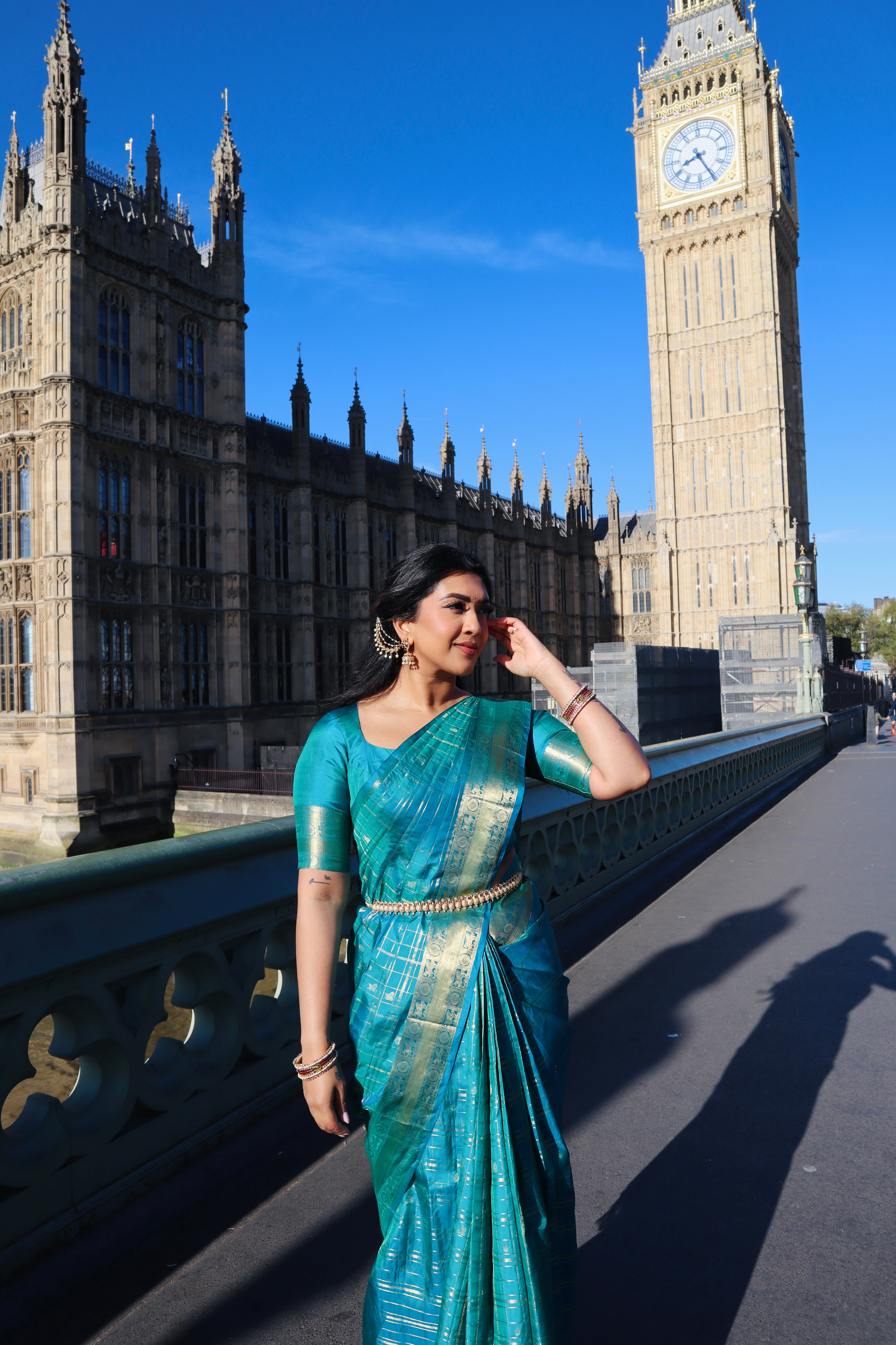 Neelambhari - Peacock Blue Vasundhara Silk Saree Gleamed Up with Zari Buttas Enclosed in Zari Checks, Featuring a Zari Border of Kuthirai and Chakra Designs, Rich Zari Pallu, with a Matching Blouse