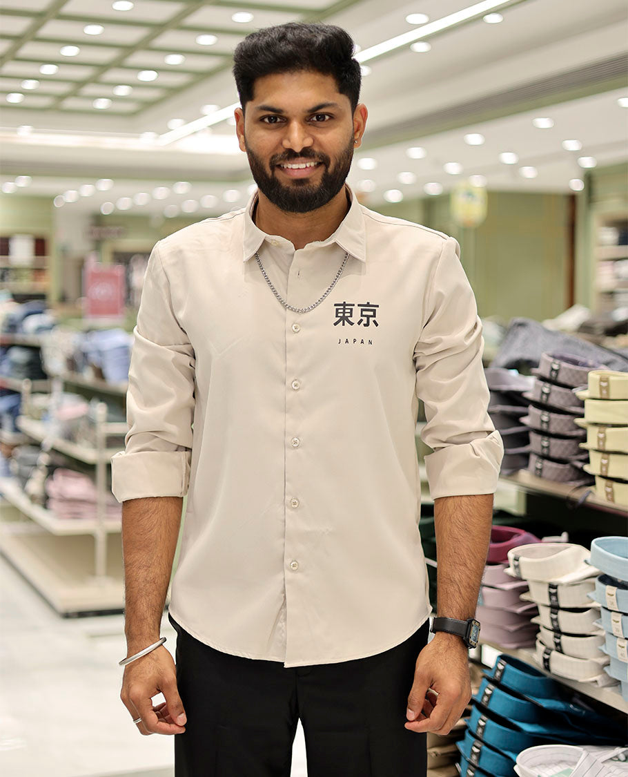 Cream Cotton-Blended Casual Shirt Features Typographic Print, Full-Sleeves, a Spread Collar, a Regular Fit, and a Regular Length