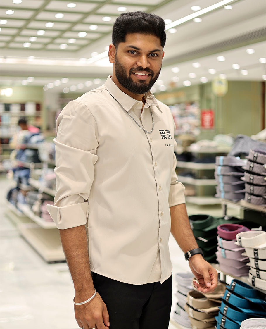 Cream Cotton-Blended Casual Shirt Features Typographic Print, Full-Sleeves, a Spread Collar, a Regular Fit, and a Regular Length