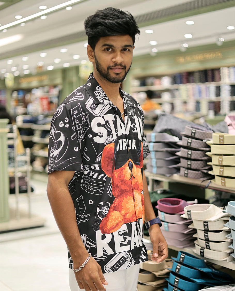 Multi-Color Poly-Blended Casual Shirt Showcasing Funky Cartoon Print, Half Sleeves, a Poly Collar, a Regular Fit, and a Regular Length