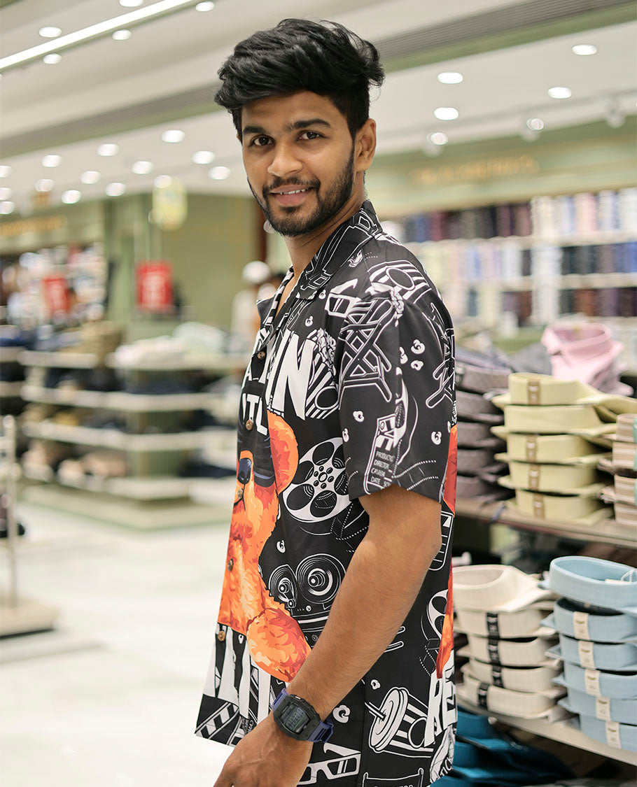Multi-Color Poly-Blended Casual Shirt Showcasing Funky Cartoon Print, Half Sleeves, a Poly Collar, a Regular Fit, and a Regular Length