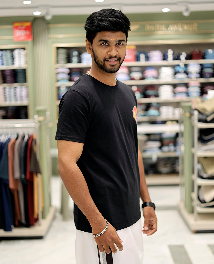 Black Cotton-Blended T-Shirt Features Multi-Colored Kathakali Print, Half-Sleeves, a Round Neck, a Slim Fit, and a Regular Length