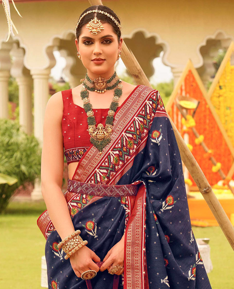 Navy blue patola floral motifs printed designer saree, contrast intricate patola border, and floral motifs patola printed pallu