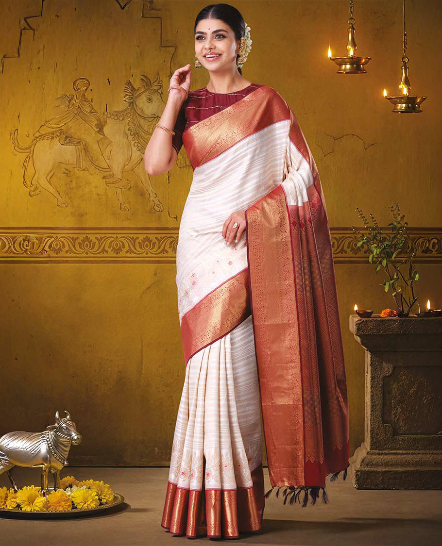 Half-white jacquard with floral meenakari design kanchipuram wedding silk saree, contrast border of thilakam, kodi visiry, laddu kamalam, and then kuli kann designs, and jaal pallu