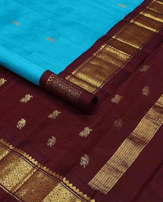 Blue buttas kancheepuram silk saree with contrast korvai border of thilakam mokku, banaras, checked design & zari design pallu