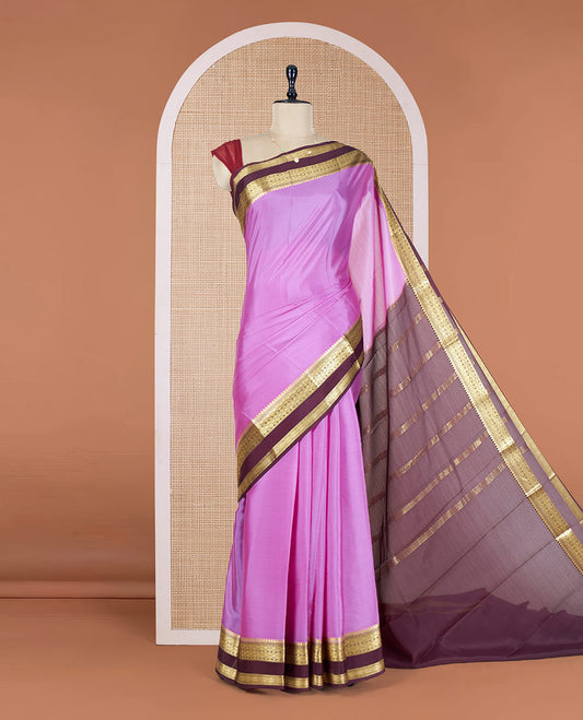 Pink Plain Mysore Silk Saree, Complemented by a Contrast Rettai Pettu Border of Traditional Zari Designs, a Simply Sparkled Pallu of Zari Stripes, and a Contrast Blouse