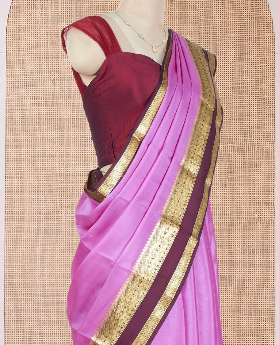 Pink Plain Mysore Silk Saree, Complemented by a Contrast Rettai Pettu Border of Traditional Zari Designs, a Simply Sparkled Pallu of Zari Stripes, and a Contrast Blouse