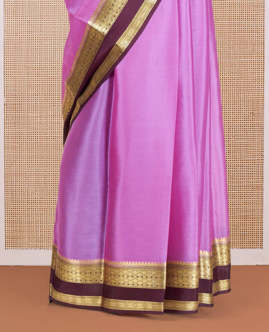 Pink Plain Mysore Silk Saree, Complemented by a Contrast Rettai Pettu Border of Traditional Zari Designs, a Simply Sparkled Pallu of Zari Stripes, and a Contrast Blouse