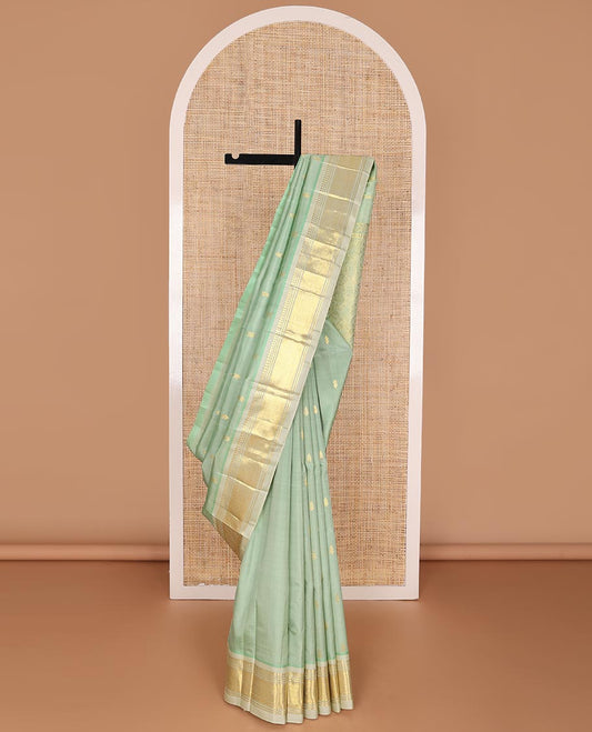 Green buttas kancheepuram silk saree with contrast border of thilakam mokku, banaras, checked design & zari design pallu