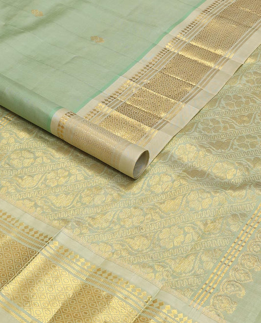 Green buttas kancheepuram silk saree with contrast border of thilakam mokku, banaras, checked design & zari design pallu