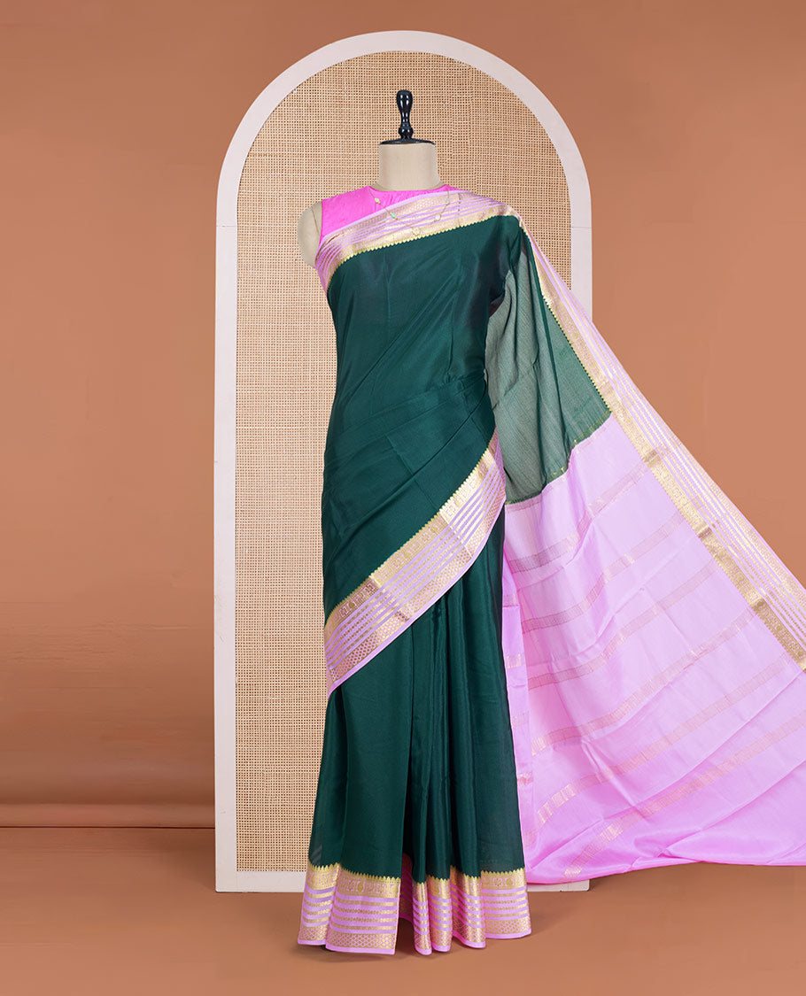 Green Plain Mysore Silk Saree, Complemented by a Contrast Varisai Pettu Border of Traditional Zari Designs, a Subtly Sparkled Pallu of Zari Stripes, and a Contrast Blouse