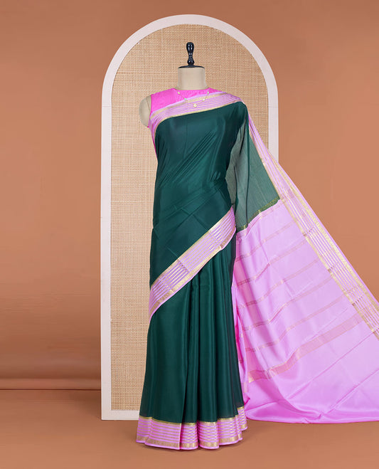 Green Plain Mysore Silk Saree, Delicately Woven by a Contrast Varisai Pettu Border of Traditional Zari Designs, a Subtly Sparkled Pallu of Zari Stripes, and a Contrast Blouse