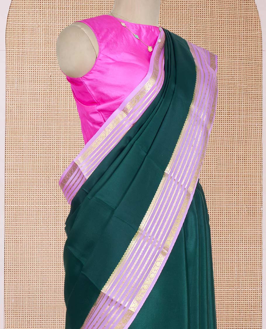 Green Plain Mysore Silk Saree, Delicately Woven by a Contrast Varisai Pettu Border of Traditional Zari Designs, a Subtly Sparkled Pallu of Zari Stripes, and a Contrast Blouse