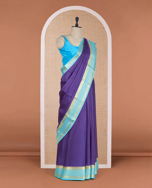 Blue Plain Mysore Silk Saree, Enthralled by a Contrast Varisai Pettu Border of Traditional Zari Designs, a Subtly Sparkled Pallu of Zari Stripes, and a Contrast Blouse