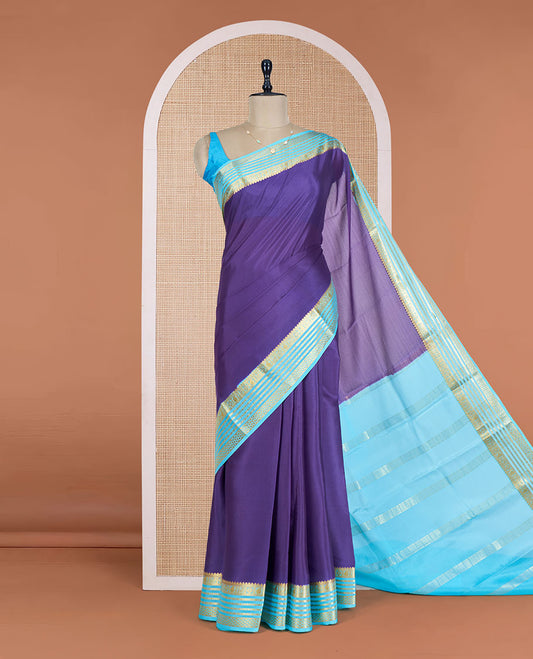 Blue Plain Mysore Silk Saree, Enthralled by a Contrast Varisai Pettu Border of Traditional Zari Designs, a Subtly Sparkled Pallu of Zari Stripes, and a Contrast Blouse