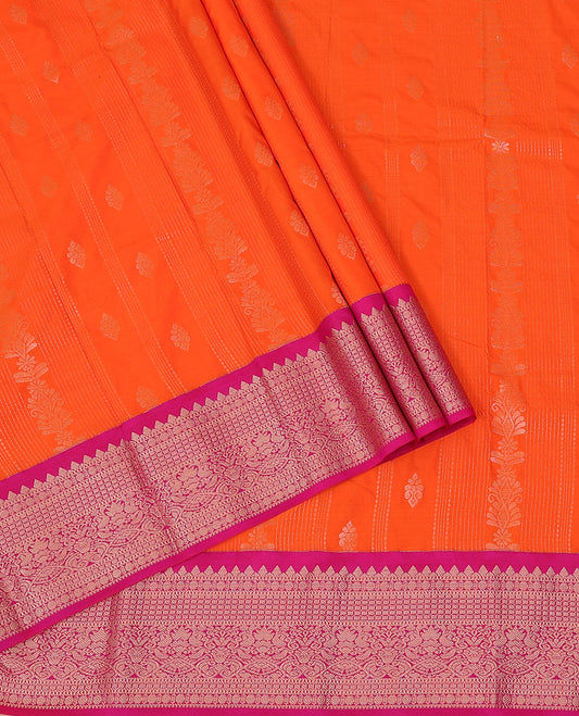 Orange Art Silk Pavadai Material Set, Adorned with Zari Designs All Over Its Skirt, Highlighted with a Contrast Traditional Zari Design Border, and Paired with a Contrast Blouse