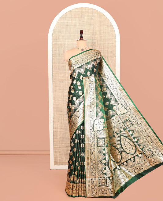 Green Banarasi Nylon Saree, Richly Detailed with Zari Buttas, Highlighted by a Traditional Zari Border, Intricate Pallu, and a Matching Blouse