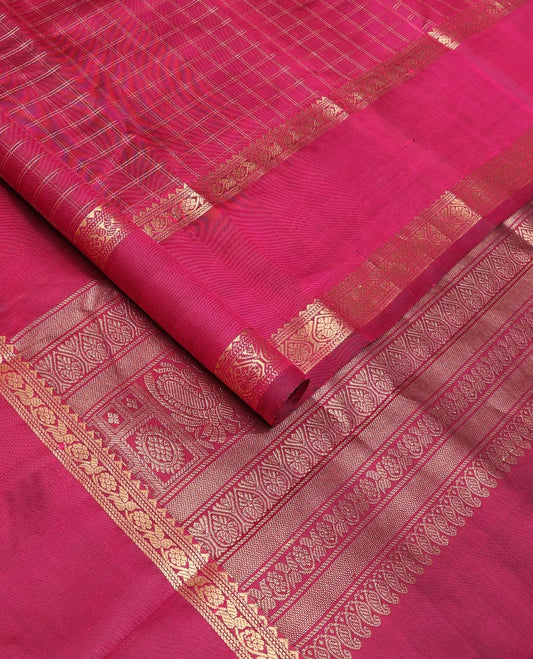 Red checked Kanchipuram silk saree, rettai pettu border of rekku, and jada nagam, and pallu of manga mokku, annam chakram, and Navagunjara designs