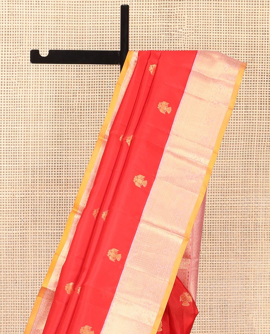 Red Vasundhara Silk Saree, Beautifully Bedecked with Iruthalai Pakshi Buttas All Over Its Body, Complemented by a Contrast Border of Rekku, Then Kuli Kann, and Kodi Visiry Designs, Grand Pallu, and Paired with a Contrast Blouse