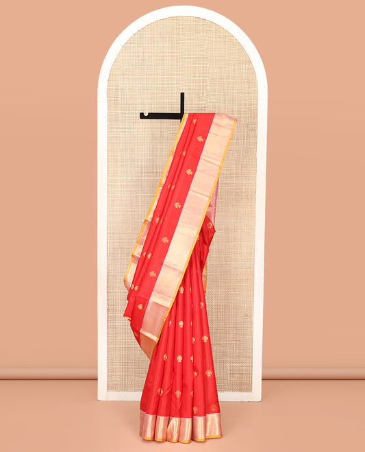 Red Vasundhara Silk Saree, Beautifully Bedecked with Iruthalai Pakshi Buttas All Over Its Body, Complemented by a Contrast Border of Rekku, Then Kuli Kann, and Kodi Visiry Designs, Grand Pallu, and Paired with a Contrast Blouse
