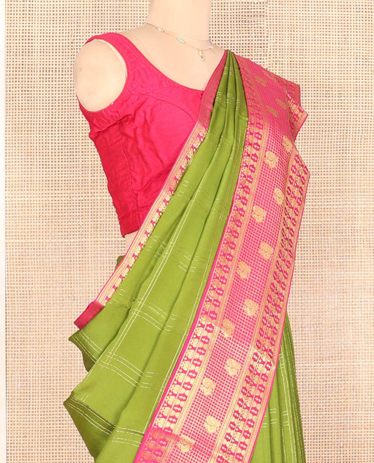 Green Mysore Silk Saree, Gracefully Embellished with Zari Checks, a Contrast Iruthalai Pakshi-Peacock Zari Border, Grand Pallu, and a Contrast Blouse