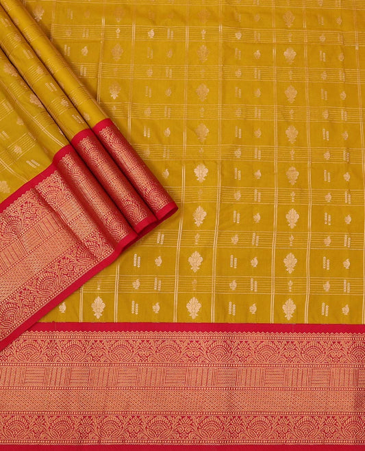 Yellow Art Silk Pavadai Material Set Featuring a Zari Butta Enclosed Checked Skirt, Complemented by a Contrast Traditional Zari Motifs Woven Border, and Paired with a Contrast Blouse