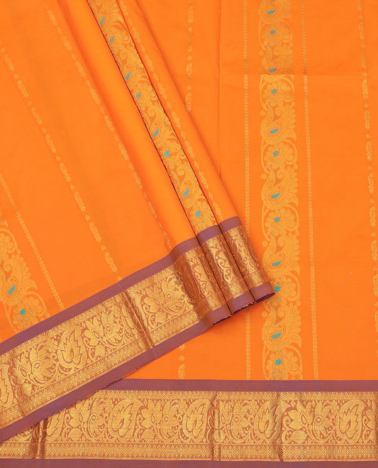 Orange Art Silk Pavadai Material Set, Woven with Zari Designs on Its Skirt, Complemented by a Contrast Traditional Zari Border, and a Matching Blouse