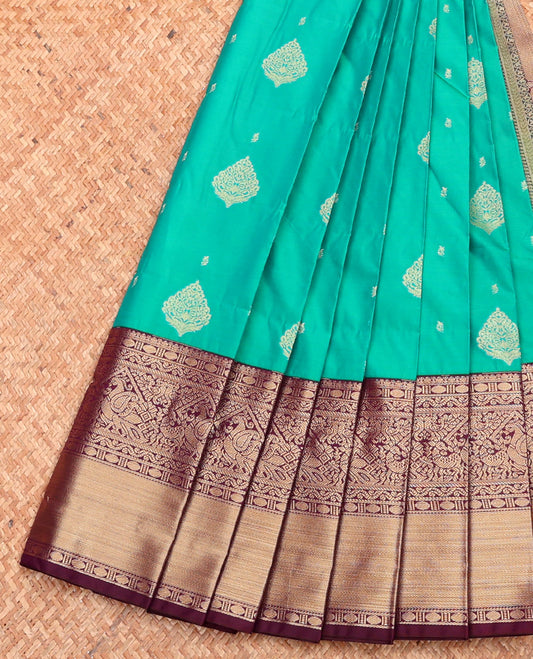 Green Budget Silk Saree, Adorned with Buttas, Complemented by a Contrast Traditional Zari Border, Grand Pallu, and Contrast Blouse