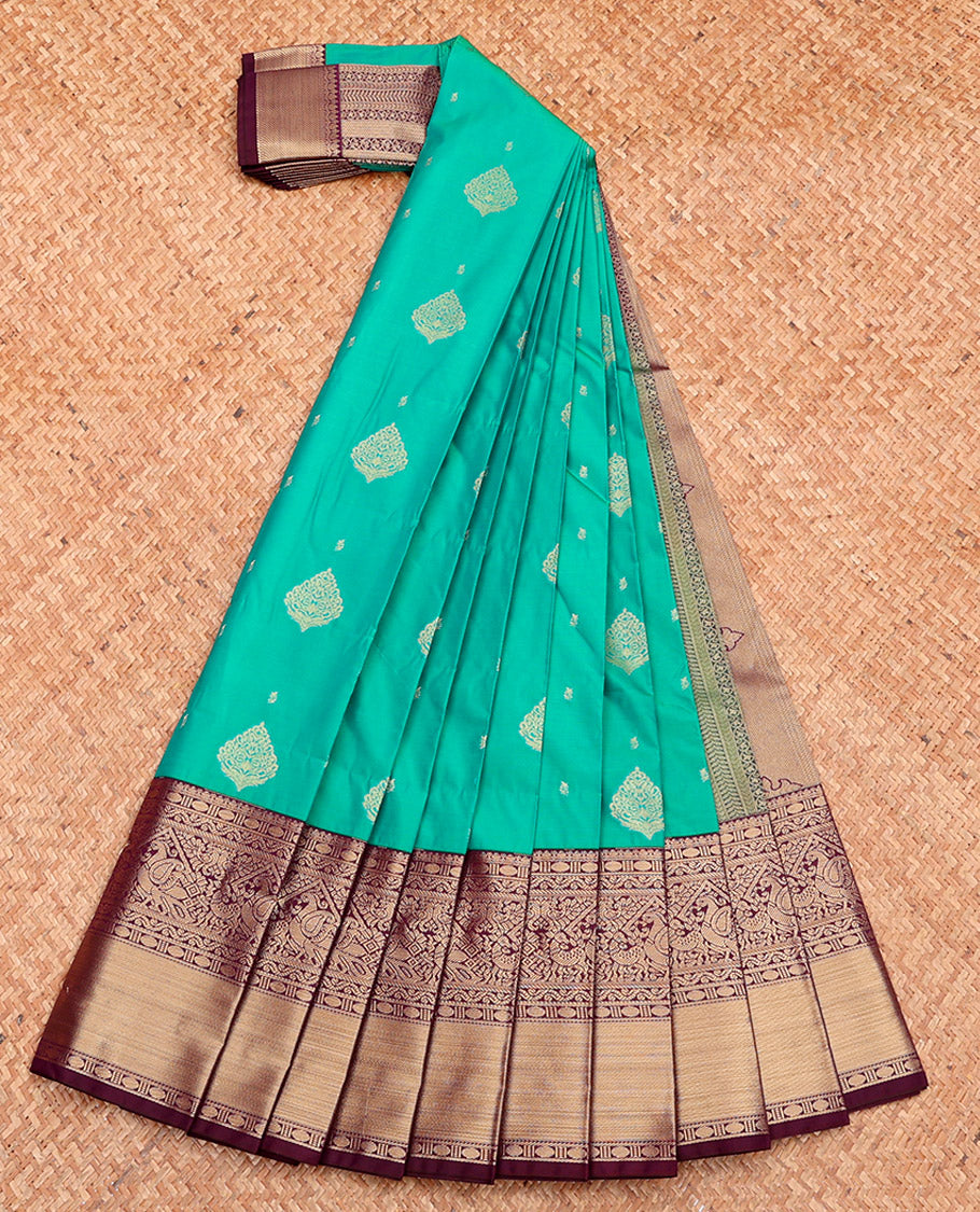 Green Budget Silk Saree, Adorned with Buttas, Complemented by a Contrast Traditional Zari Border, Grand Pallu, and Contrast Blouse