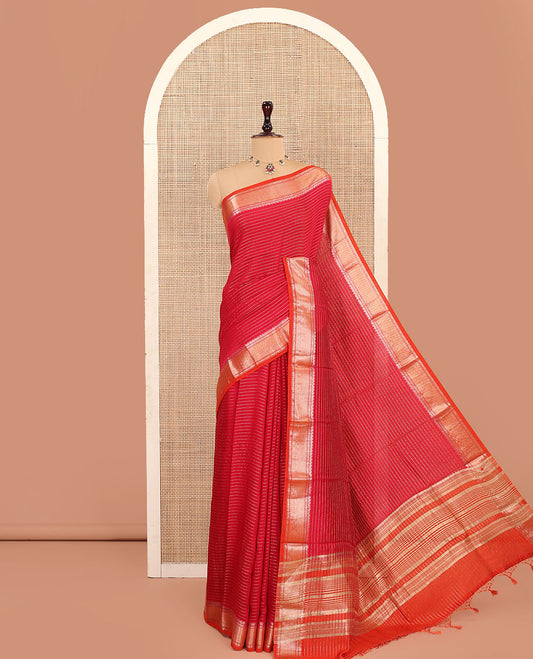 Red Assam Silk Saree, Enthralled with Zari Designs on Its Body, Complemented by a Contrast Traditional Zari Design Border, Pallu Steeped with Gleaming Zari Stripes, and Paired with a Contrast Blouse
