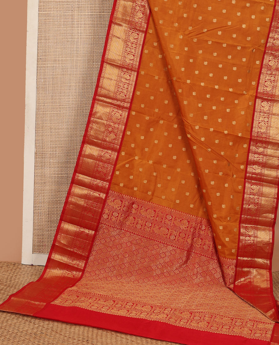 Orange peacock zari buttas Bangalore silk saree, contrast traditional zari border, and pallu of ogee patterns