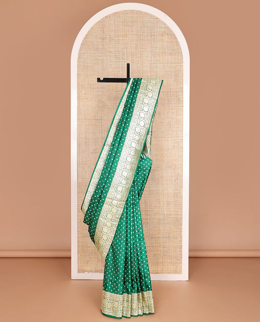 Green banarasi silk saree with zari buttas, zari border of floral creeper designs & zari-rich pallu of intricate floral designs