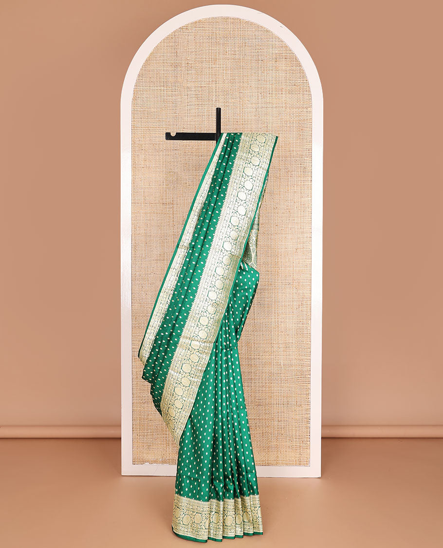 Green banarasi silk saree with zari buttas, zari border of floral creeper designs & zari-rich pallu of intricate floral designs