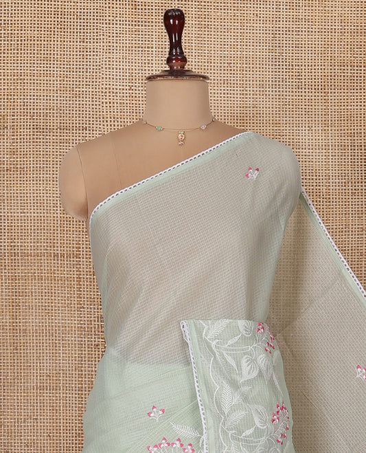 Green Kota Cotton Saree, Artfully Detailed with Floral Motifs Thread Embroidery on Its Body, Scallop Lace Border, Pallu Pictures Same Embroidery, and Paired with a Matching Blouse