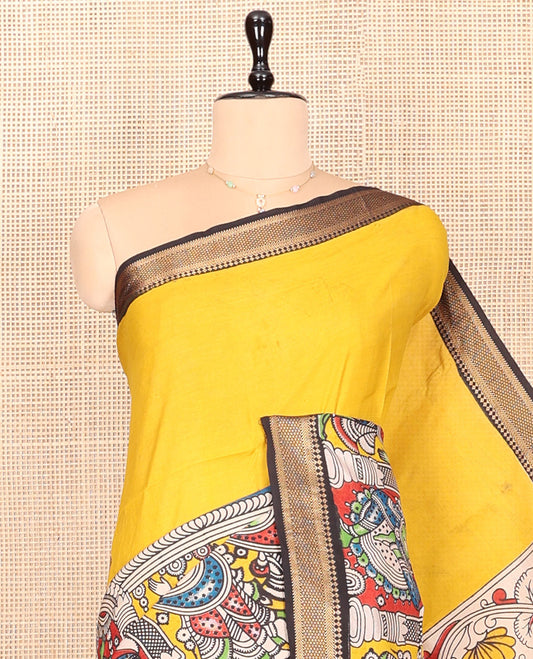 Yellow Kalamkari Cotton Saree, Adorned with Human Figurine Print, Contrast Traditional Zari Border, Peacock Pallu, and a Contrast Blouse