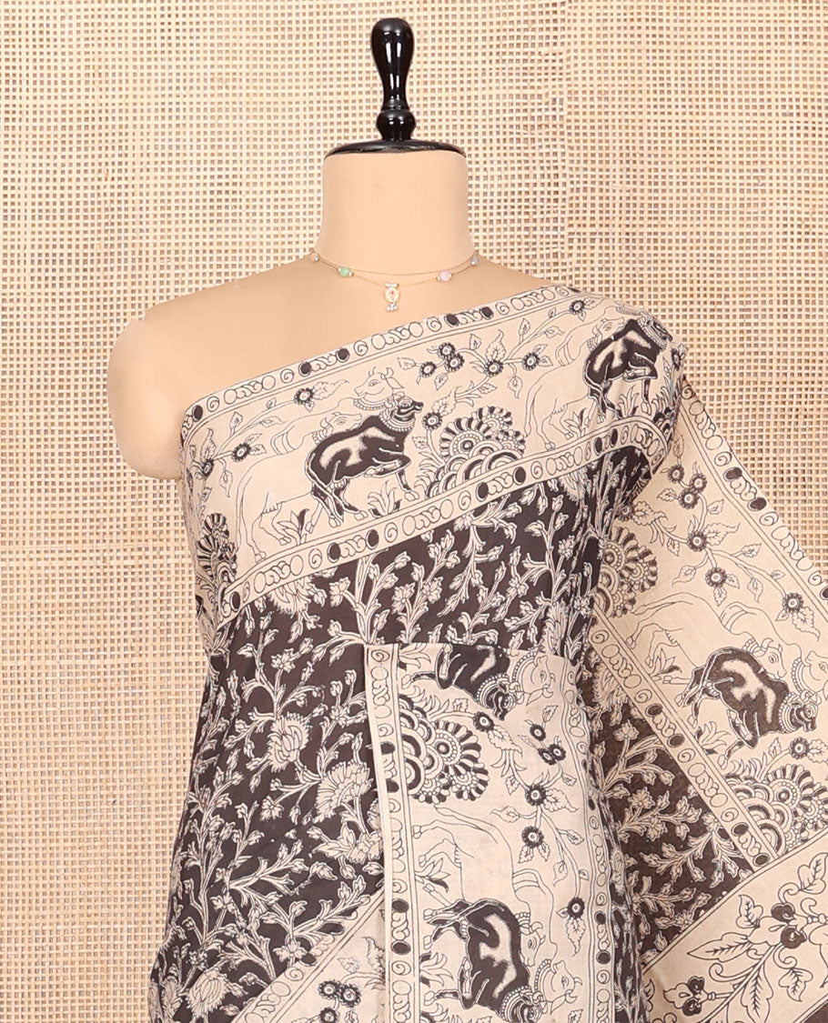 Black Machine Printed Kalamkari Cotton Saree Features a Floral Vine, Contrast Pichwai-Printed Border, Peacock-Printed Pallu, and a Matching Blouse