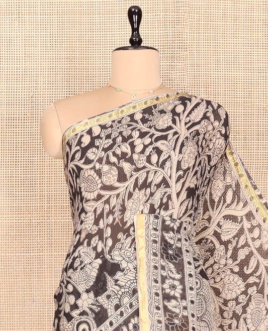 Black Machine-Printed Kalamkari Cotton Saree Features Floral Vine and Pichwai Cow, a Piping Border, Kalamkari Peacock Pallu, and a Matching Blouse